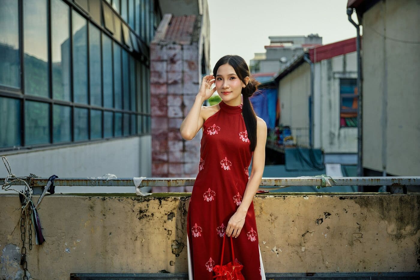 Woman in a red ao dai in Hanoi's Old Quarter