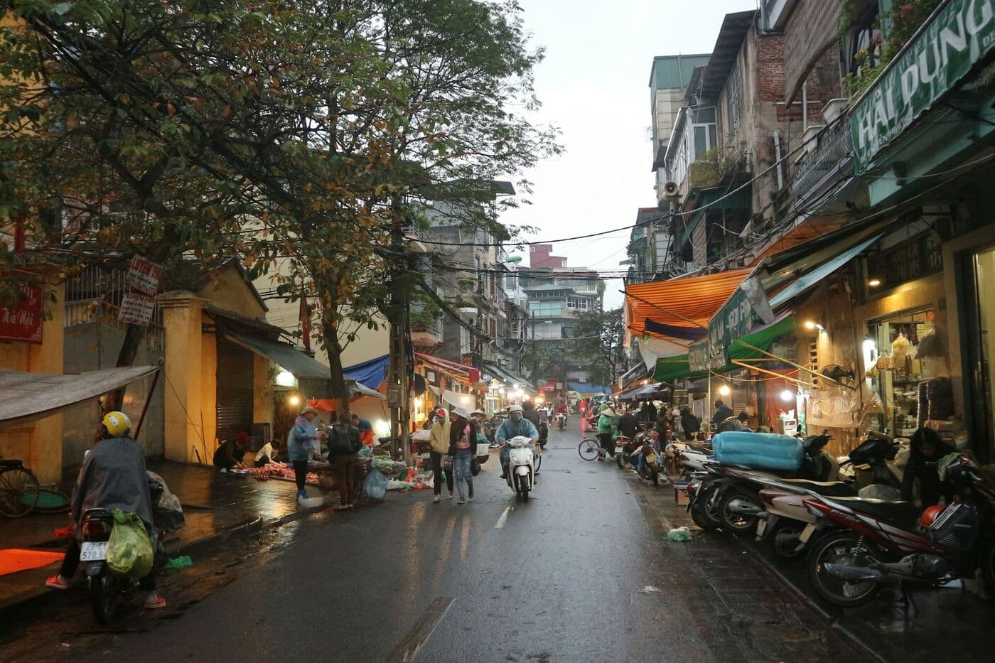 Motorbikes and shops on a Hanoi street
